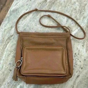 Sanctuary Women’s Crossbody purse light brown. 100%leather magnetic top closure